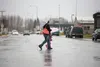 Pedestrians with umbrellas cross South Bailey Street in downtown Palmer Monday morning. According to the National Weather Service, the forecast calls for partly sunny skies today with isolate
