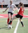 Wasilla High's Alexa Starr makes a move for the ball during a match against Kenai in the 2014 season. Recently, Starr helped the Cook Inlet Soccer Club Velocity 97 team win a Tier II national