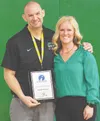 Celebrated band director Dr. Jamin Burton, pictured with Colony principal Kristy Johnston, has been named Alaska's 2027 Teacher of the Year. Courtesy of Mat-Su Borough School District