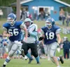 ROBERT DeBERRY/Frontiersman Palmer senior Collin Christiansen
(18) follows a blocker, Jameson Corbin (66), down the field against
Chugiak last week. Palmer, now ranked fourth in the latest AS
