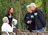 Joann and Don Mueller, right, talk to a fellow Big Lake property owner with their daughter-in-law, Ina Mueller, left, at the Big Lake Block Party right before the Miller's Reach Fire 20-year 