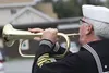 John Mathew performs taps on a traditional valve-less bugle Monday outside the Wasilla Legislative Office. The citation includes the history of taps, the instantly recognizable 24-note, eight