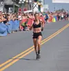 Christy Marvin sprints toward the finish line during the annual Mount Marathon Thursday in Seward. The Palmer runner finished second in the women’s race. Jeff Helminiak/Peninsula Clarion