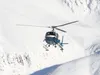 The Alaska State Trooper Helo-1 lands in a parking area in the Hatcher Pass area during a avalanche search and rescue mission in this March 2011 image. The trooper helicopter went down March 
