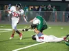 Colony's Bryce Niver is taken down by Juneau's Demetrius Campos during Friday's game at Colony High School. The Bears defeated the Knights 33-24. ROBERT DeBERRY/Frontiersman.com