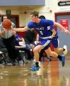 Palmer's Elijah Barnes moves the ball down the floor during a win over Wasilla. photos Courtesy of Bruce Eggleston/matsusports.net