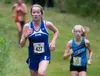 Palmer High School freshman Katey Houser leads Chugiak's Adrianna Proffitt near the halfway point of the varisty girls race at the 2018 Tsaltesha Invite in Soldota on Saturday, August 18. Hou