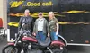 Knik Kountry Liquor owner Duane Hart and manager Susan Hart-Glansbeak pose for a photo with Harold Marble of Wasilla, who won a drawing for a new Harley-Davidson Street Bob motorcycle valued 