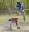 Palmer's Owen Hayes jumps over Kenai pitcher Simon Grenier. Hayes was able to take third base safely for a triple Thursday, May 27, 2021, at the Southcentral Conference tournament at the Sold