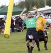 A kilted athlete tosses a telephone pole during the Alaska Scottish Highland Games. Frontiersman file art.