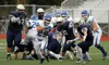 Palmer senior running back Jeff Glynn breaks through the middle of the Eagle River defense during a 75-yard touchdown run. Glenn was one of three Palmer players to run for touchdowns of 72 ya