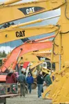 ROBERT DeBERRY/Frontiersman Auction-goers examine heavy
equipment up for sale at Saturday’s Ritchie Bros. Auction at the
Alaska State Fairgrounds in Palmer.