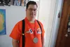 Glacier Morrow shows his American Red Cross Adult Good Samaritan Hero medal, a reminder of his bravery during a 2018 house fire. Photos by Jacob Mann/Frontiersman