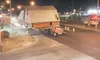 The Breeden barn moves slowly through the Parks Highway and Main
Street intersection early Sunday morning. The traffic signal cross
poles had to be moved from over top of the intersection bef