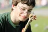 ROBERT DeBERRY/Frontiersman Jeremy Anderson, 14, looks at his
picked clean turkey leg with satisfaction Tuesday afternoon at the
Alaska State Fair.