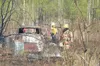 ANDREW WELLNER/Frontiersman Blackened trees stand around a pile
of debris that contained a pile of tires. The tires burned during a
half-acre brushfire in the neighborhoods off Pittman Road n