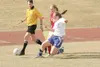 ROBERT DeBERRY/Frontiersman Palmer senior Clair Woodings moves
toward Wasilla freshman Kendra Miner for control of the ball during
Monday's game at Palmer High School.