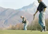 ROBERT DeBERRY/Frontiersman Ben Cabo, right, watches as Jim Jett
attempts a putt on the sixth hole at Fishhook Golf Course on
Thursday afternoon. Golfers were treated to a slight breeze and
s