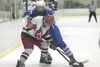 ROBERT DeBERRY/Frontiersman Wasilla’s Troy Verplancke and
Palmer’s Miles George battle for the puck during Friday’s game at
the Curtis D. Menard Memorial Sports Center in Wasilla. Robert DeBe