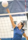 ROBERT DeBERRY/Frontiersman Palmer's Nicole Kenney taps the ball
over the net during Thursday's game against the Cordova Wolverines.
Cordova won the match in five games.