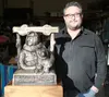 Palmer bronze artist Pat Garley poses Tuesday, March 1, 2016 with the new Iditarod Trail Sled Dog Race winner’s trophy he recently finished for this year’s race. The trophy is based on a phot