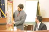 ROBERT DeBERRY/Frontiersman Palmer District Attorney Roman
Kalytiak, left, holds the machete used during a fatal Dec. 2, 2007,
attack as Oregon Deputy Medical Examiner Christopher Young
testi