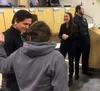Green Jar marijuana dispensary owners Caleb Saunders, left, Bailey Steward, middle and Chris Farris, right, celebrate after the Mat-Su Borough Planning Commission approved their request for a