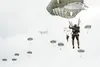 Paratroopers assigned to the 4th Infantry Brigade Combat Team (Airborne), 25th Infantry Division, U.S. Army Alaska, descend after jumping from a C-17 Globemaster III out of Joint Base Charles