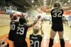 ROBERT DeBERRY/Frontiersman Members of the Colony varsity
volleyball squad jump out of their seats Thursday after beating the
Juneau-Douglas Crimson Bears in the opening round of the state
vo