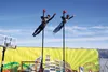 Photo courtesy Andrew WellnerKidani Tilaye (right) and Matthew McConarty seem to defy gravity on a pair of poles in the Purple Plaza of the Alaska State Fairgrounds. The performance was one o