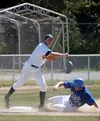 Mat-Su third baseman Matt Edwards (above) gets the force out at
third and makes the throw to first to notch the double play during
the Miners' 8-0 loss to the Anchorage Glacier Pilots on Sund