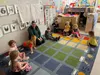 Palmer head start teacher Moriah Morris sits with children.  Photo courtesy of Mark Lackey
