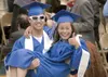 GREG JOHNSON/Frontiersman Dylan Danielowski carries Sierra
Shelton down the aisle at Palmer High School’s graduation ceremony
Thursday for the class of 2010.