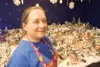 Happy Dawn Thrift Store owner Dawn Baker stands next to her
Christmas Village. She has been collecting for about nine years and
setting up the village in the thrift store for three years. It
