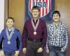 Photo courtesy of Mike Kelly Logan Spencer, Shawn Kelly and
Tyler Kelly pose with their medals after placing during a Junior
Olympic State Championship last Friday. Shawn Kelly won gold,
Spen