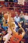 Wasilla senior guard Joel Quenga drives to the basket for two
points during the Warriors game against the West High Eagles
Thursday at Wasilla High School. (ROBERT DeBERRY/Frontiersman)
