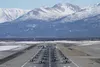 Twenty-four F-22 Raptors from 3rd Wing and 477th Fighter Group, a C-17 Globemaster III and an E-3 Sentry participate in a close formation taxi, known as an Elephant Walk, March 26, 2019, duri