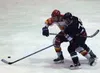 Chris Crosta of the Colony Knights battles Corey Coxen of the
West Valley Wolfpack for the puck in the Colony zone. The Wolfpack
used a big third period to defeat the Knights 9-1 in Fairbanks