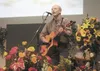 Steve Pahkala, a Matanuska Electric Association lineman, plays 'I’ll Fly Away' at the end of Tuesday’s celebration of life for Cheryll Heinze, former lawmaker and MEA executive, who died in a