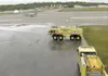 ANDREW WELLNER/Frontiersman Fire crews at Elmendorf Air Force
Base clean the runway Thursday as part of the extensive Red Flag
Alaska war games.