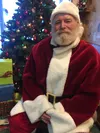Sleepy Dog Coffee Co. owner Lee Raymond dressed as Santa and took little ones’ requests during Merry Merchant Munch on Friday, Dec. 2.