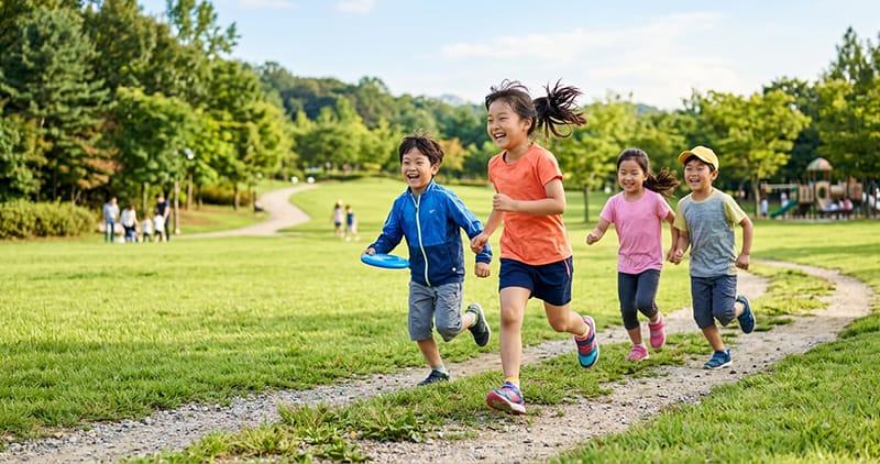 Children enjoying outdoor playtime together in bright sunlight