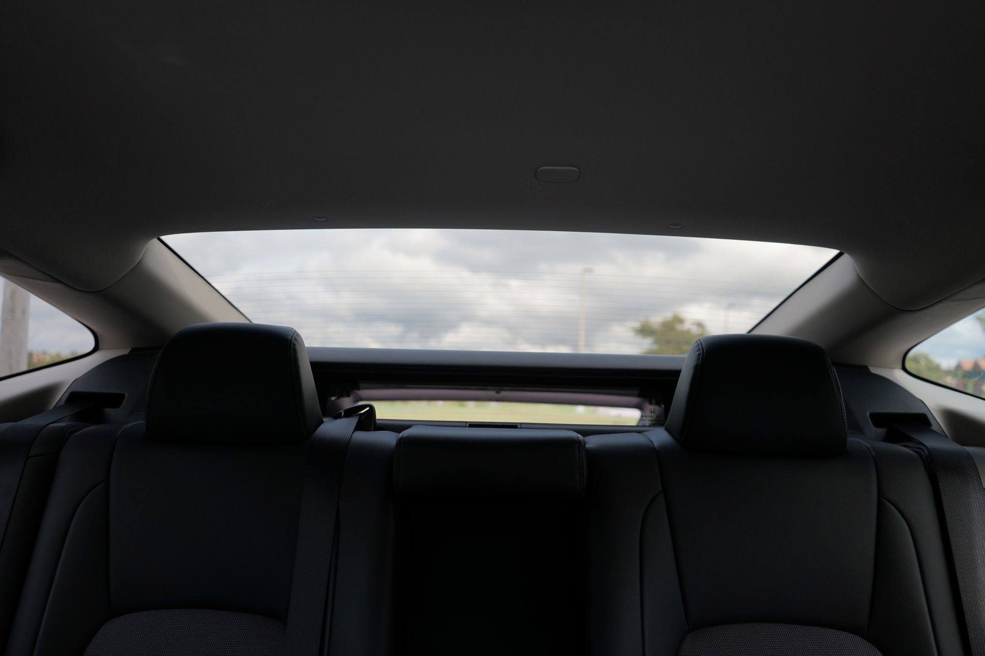 Looking backwards through rear passthrough window from inside car