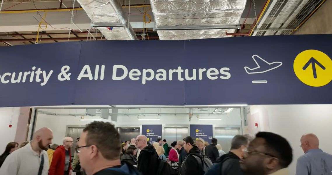Airport anguish as holiday makers forced to queue for hours
