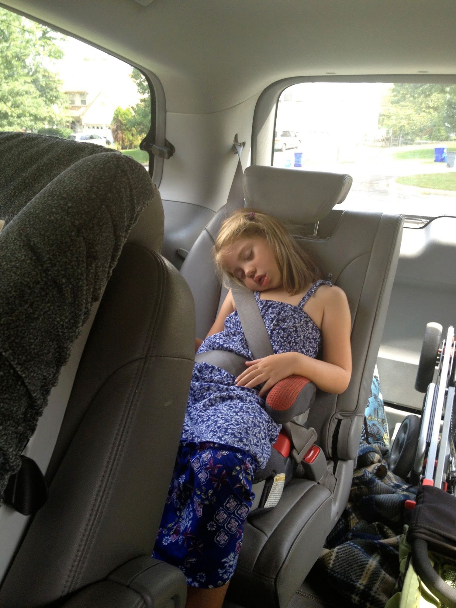 Anxious about meeting her new teacher, attending the preschool open house, and exchanging her beautiful light up shoes for shoes that don't hurt her feet made her one tired lady who fell asleep in the van before noon.