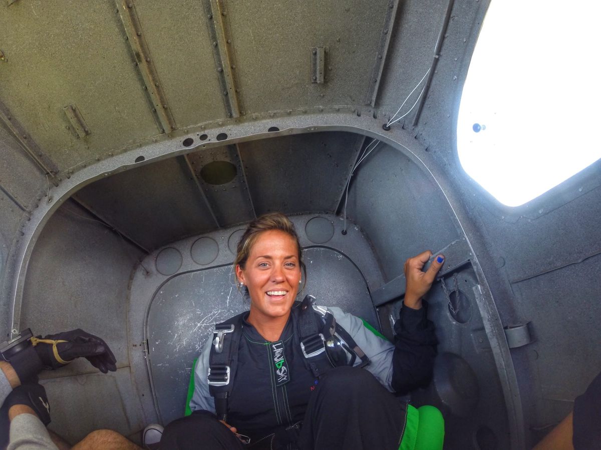The author, Kat, in the back of a Cessna about to jump out of a plane. 😄