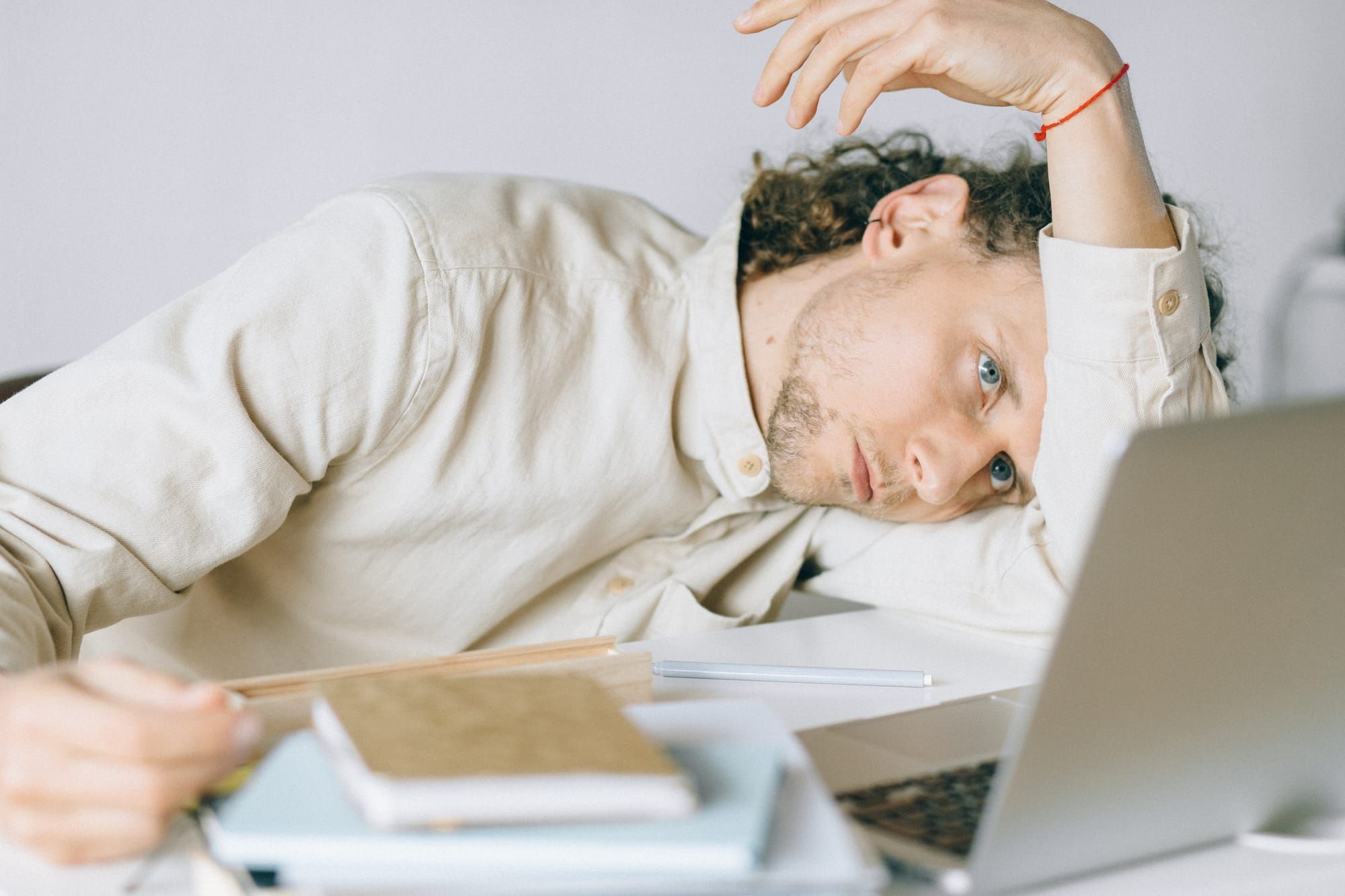 young man in front of a laptop, mental wellbeing
