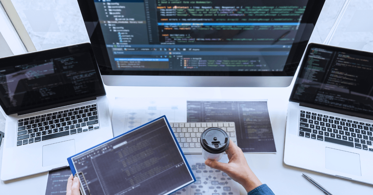ai in software product development software developer with laptops and computer