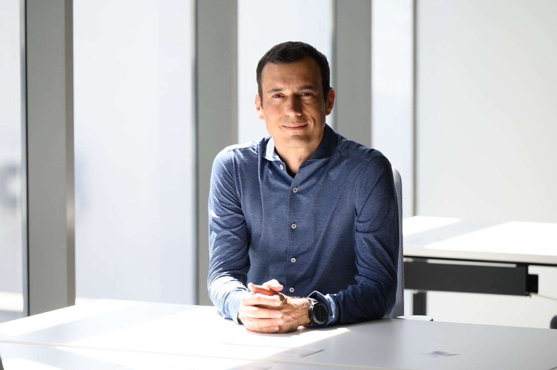Vassil Terziev, sitting in a white office