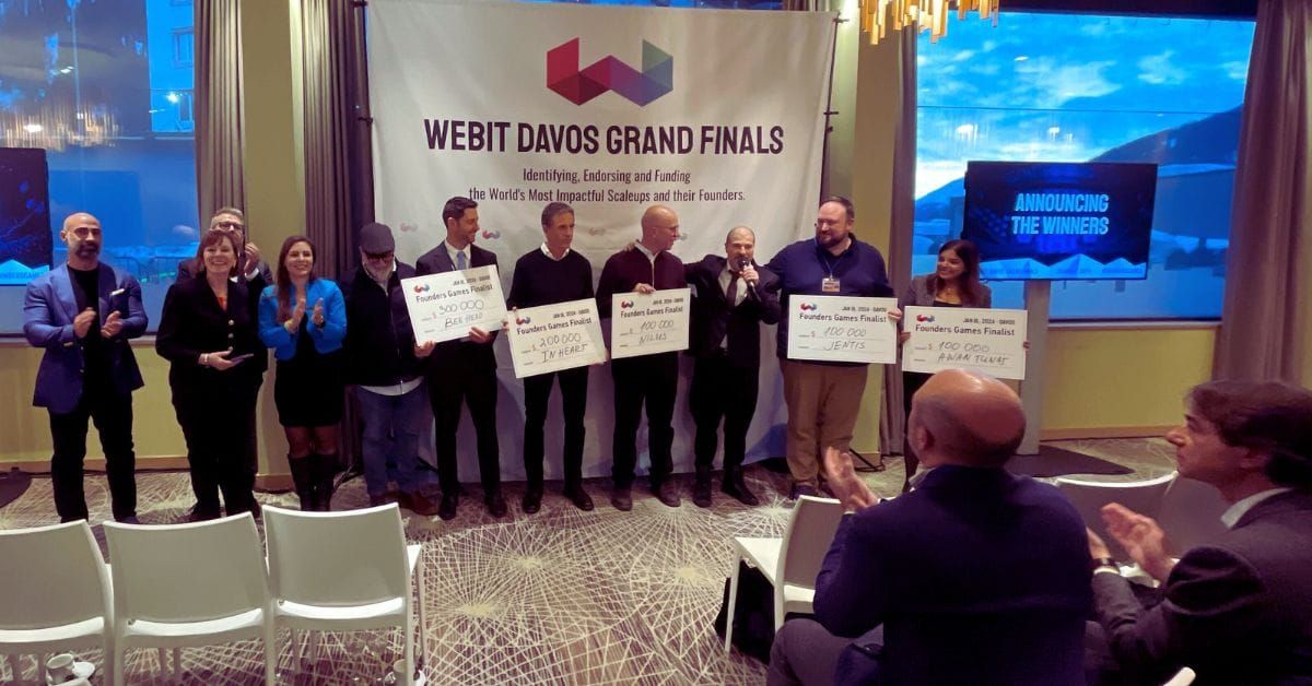 Six men and one woman posing for a picture after a competition